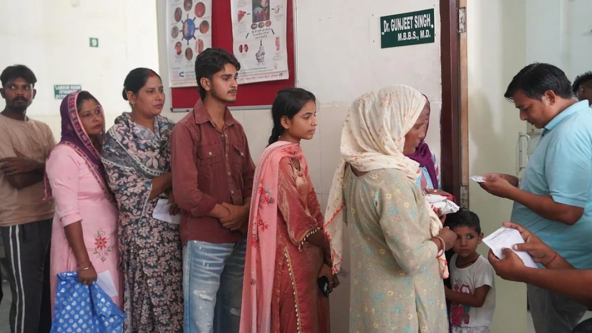 A healthcare worker conducting an ECG test on a patient