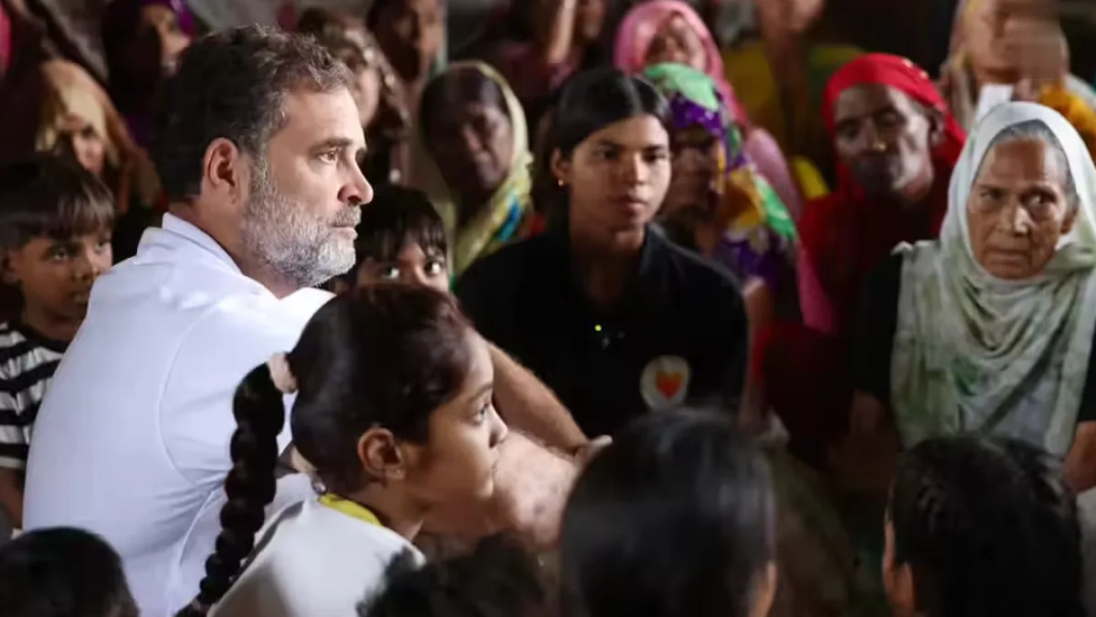 A slum area in Delhi with residents gathered