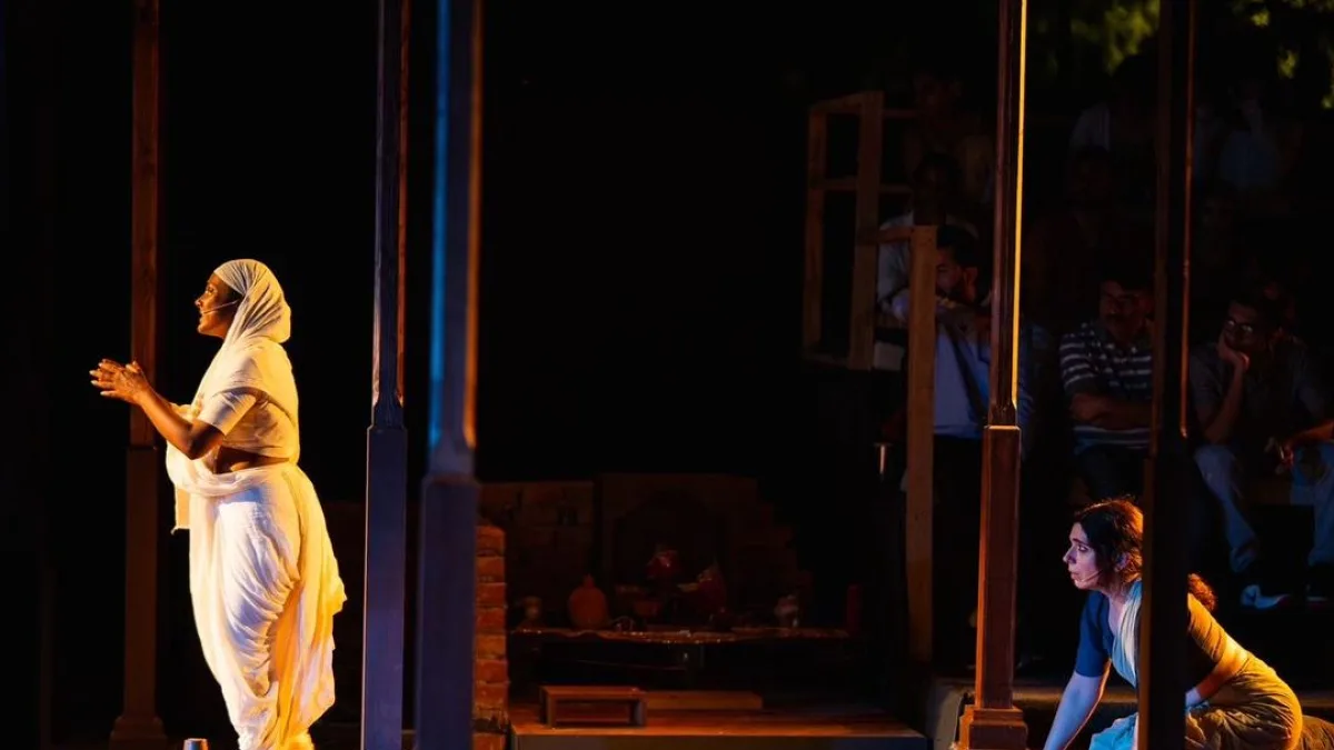 Audience watching a play in a outdoor setting