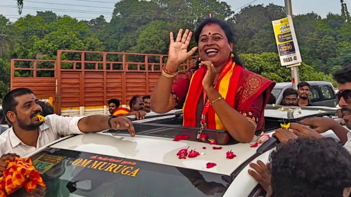 Politicians and supporters celebrating bypoll results