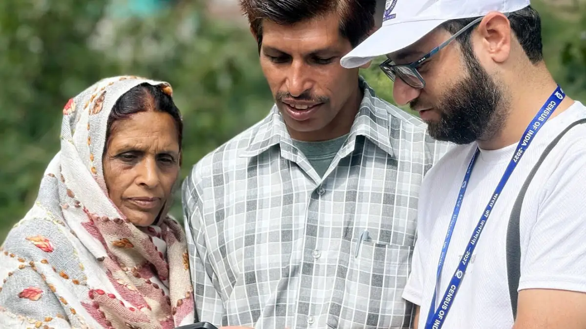 A census enumerator collecting data from a household
