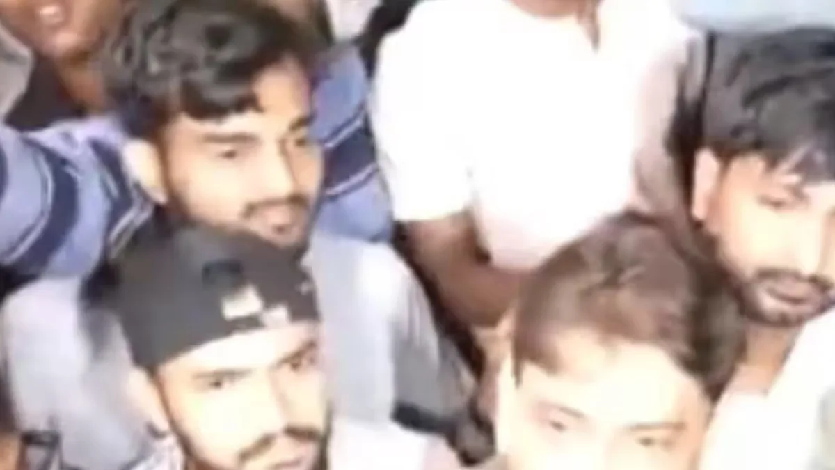 Students protesting near a university gate