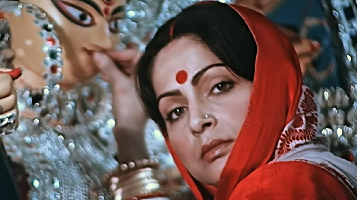 A woman praying to Durga during Puja
