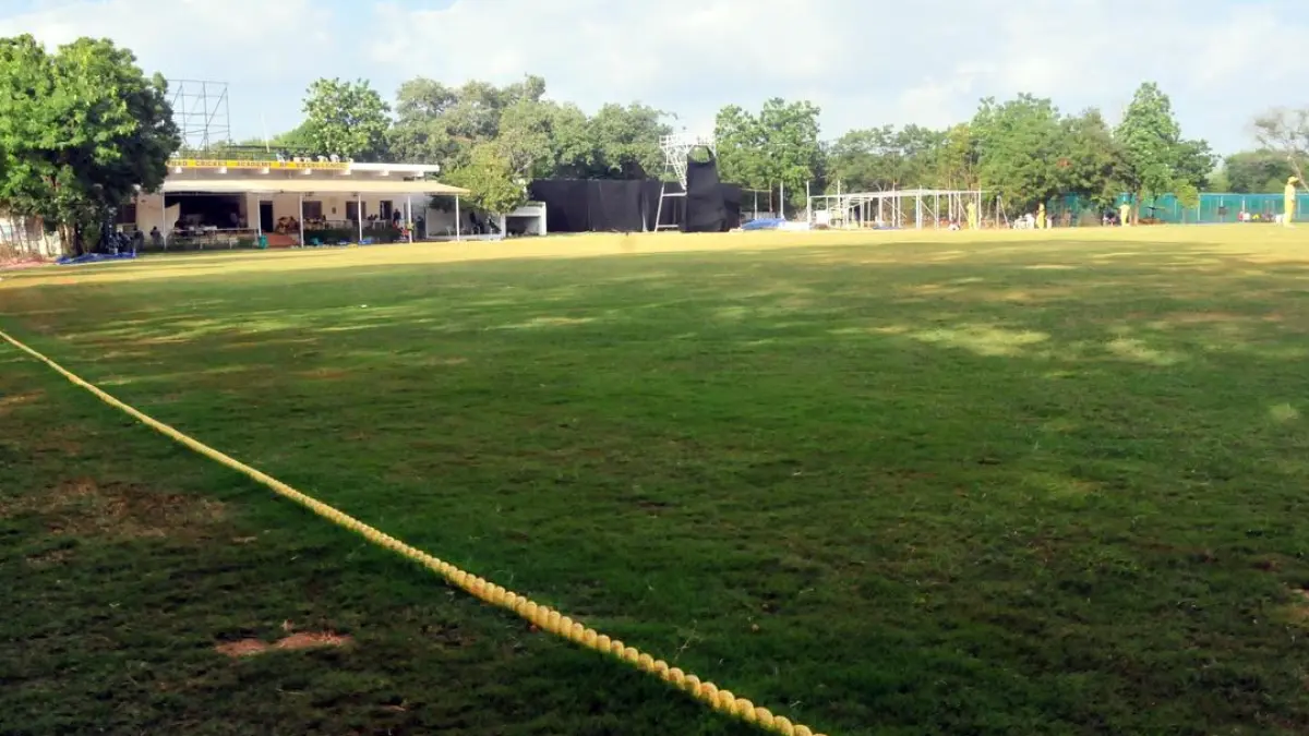 Cricket players on a field during a match