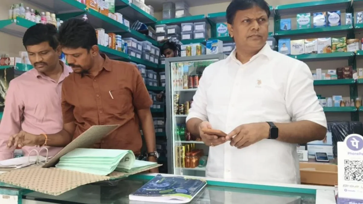 Pharmacist checking medicine records