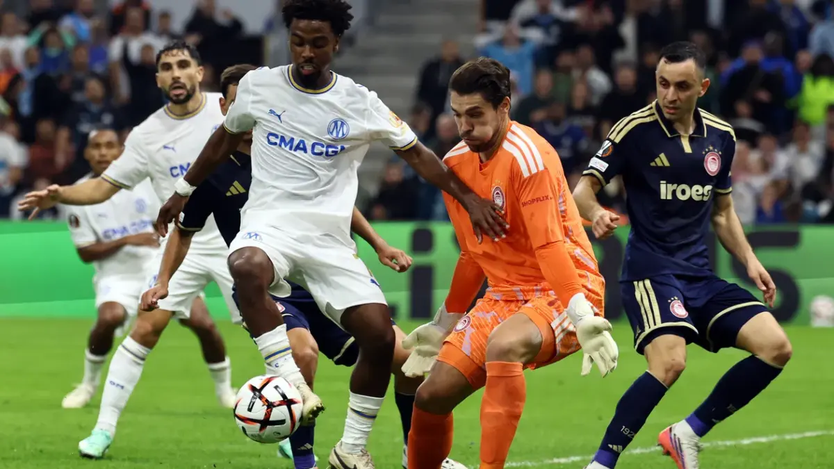 Football players in action during a match