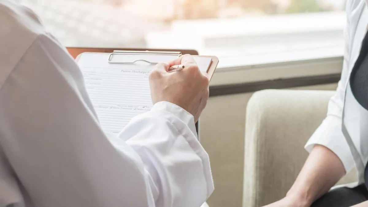 A woman consulting with a doctor in a medical clinic