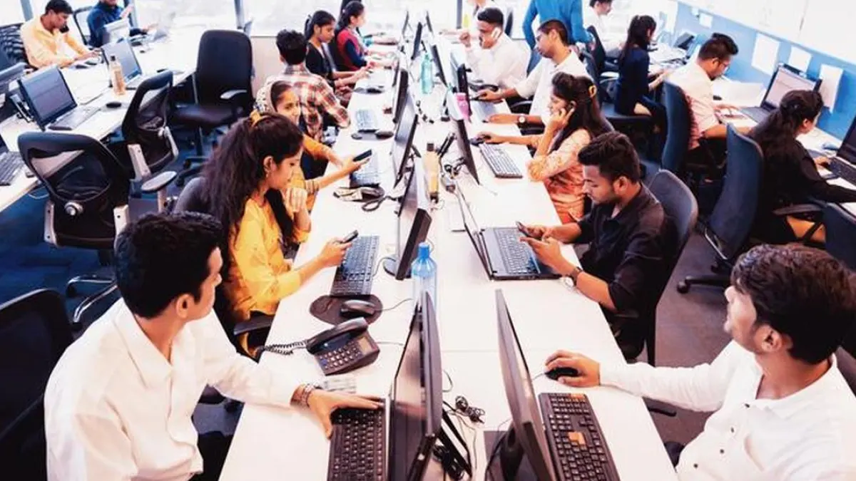Office workers sitting at desks with good posture